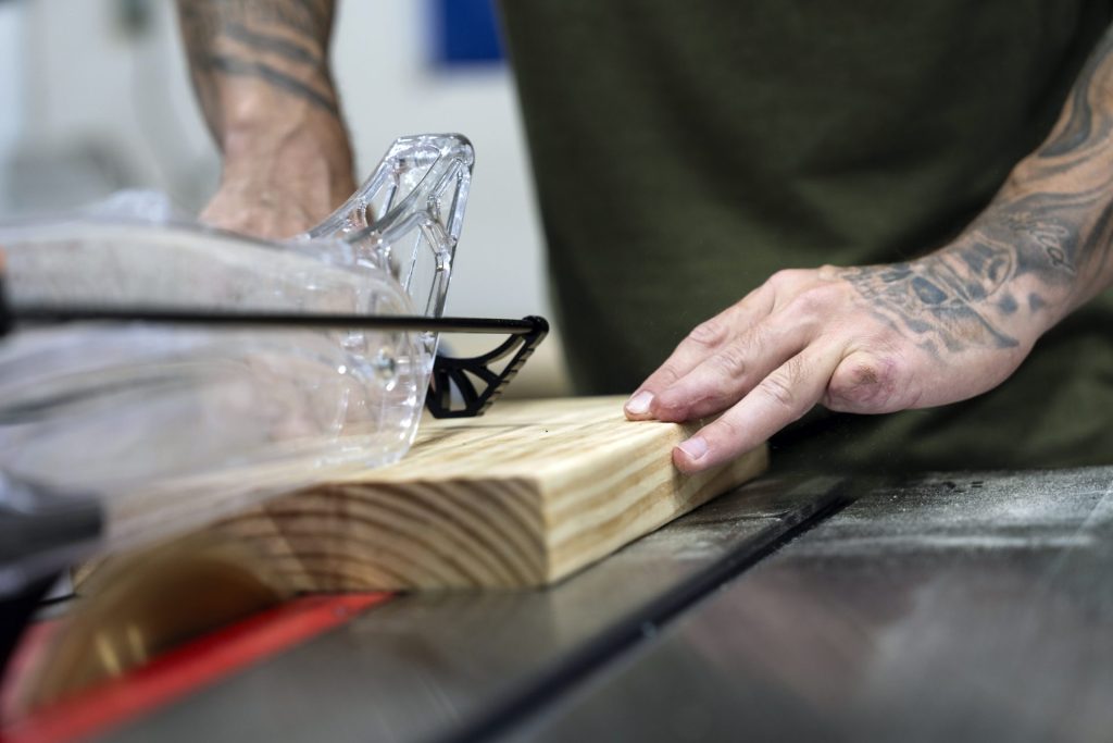 Cody Simmons cutting a board on his new SawStop saw